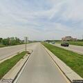Metal debris falling from dumpster truck on highway