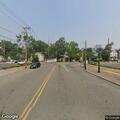 Officer stands by with disabled vehicle in roadway