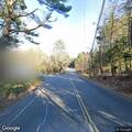 Motorcycle crash with injured passenger on Monson Road