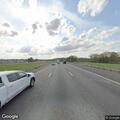 Vehicle on shoulder causing traffic hazard