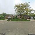 Suspicious car driving slowly through neighborhood