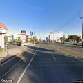 Woman sitting in middle of Lankershim Boulevard
