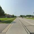 Man walking in traffic near (address_number withheld) and Kedzie