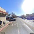 Male trespassing and possibly unconscious on sidewalk