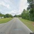 Traffic stop on gray Jeep at highway intersection