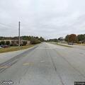 Pickup truck driving on wrong side of road