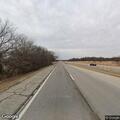 Confused man walking on highway near Beggs exit