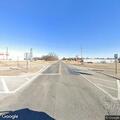 Elderly man walking on highway near Apache