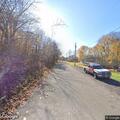 Person acting oddly on road at Elm St in Jamestown
