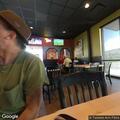 Officer checks on shirtless man near Texan Cafe