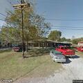 Person experiencing back pain near Galveston Street