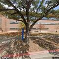 Officer checks open door at campus building