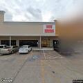 Woman with back pain after car accident at gym