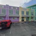 Driver with possible gun drives toward building