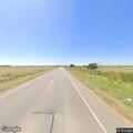 Vehicle stopped on shoulder at sharp curve