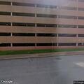 Person stopping cars in parking garage