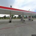 Person lying near gas station checked by responders
