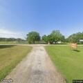Man in red shirt found unresponsive in park driveway