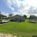 Person trying to open front door at Lexington home