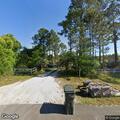 Brush fire rekindle at residential home