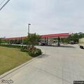 Woman reports being hit by pickup at gas station