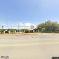 Man yelling outside RV, possibly holding a tool