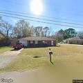 Suspicious person riding bicycle in neighborhood