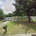 Dog with paw impaled on fence at Blue Springs Drive