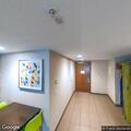Male stroke patient with numbness in hotel lobby