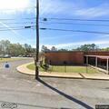 Tree limb on power line behind Northside School