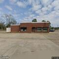 Disabled vehicle in front of auto parts store