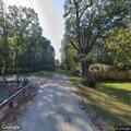 Person with trespass warning in backyard