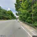 Man in severe back pain in vehicle on Albany Post Road