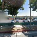 Two people fighting in parking lot crowd