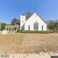Officer conducting gun check at church