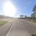 Woman removed after disturbance at highway business