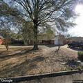 Person knocking on door at Ashley Lane home
