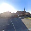 Officers check white Ford Escape at church lot