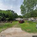 Uncontrolled trash fire with explosions in yard