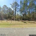 Equipment fire in woods off Highway 587