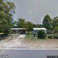 Brush fire spreading into tree in Broxton yard