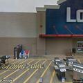 Officer checks vehicle in store parking lot