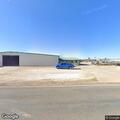 Officer checks open gate at Bosque Supply