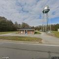 Officer conducts traffic stop on gray Ford SUV