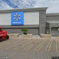 Officer checks vehicle in front of Walmart