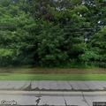 Person refusing to leave driveway at Main Street home