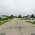 Woman vomiting outside near Amanda Street in North Prairie