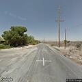 Person with abdominal pain at Yucca Valley intersection