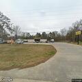 Dead dog blocking road near Dollar General