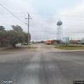 Tree branch creating traffic hazard at intersection